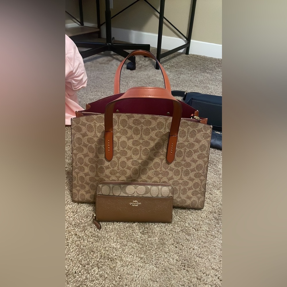brown/dark red coach bag.